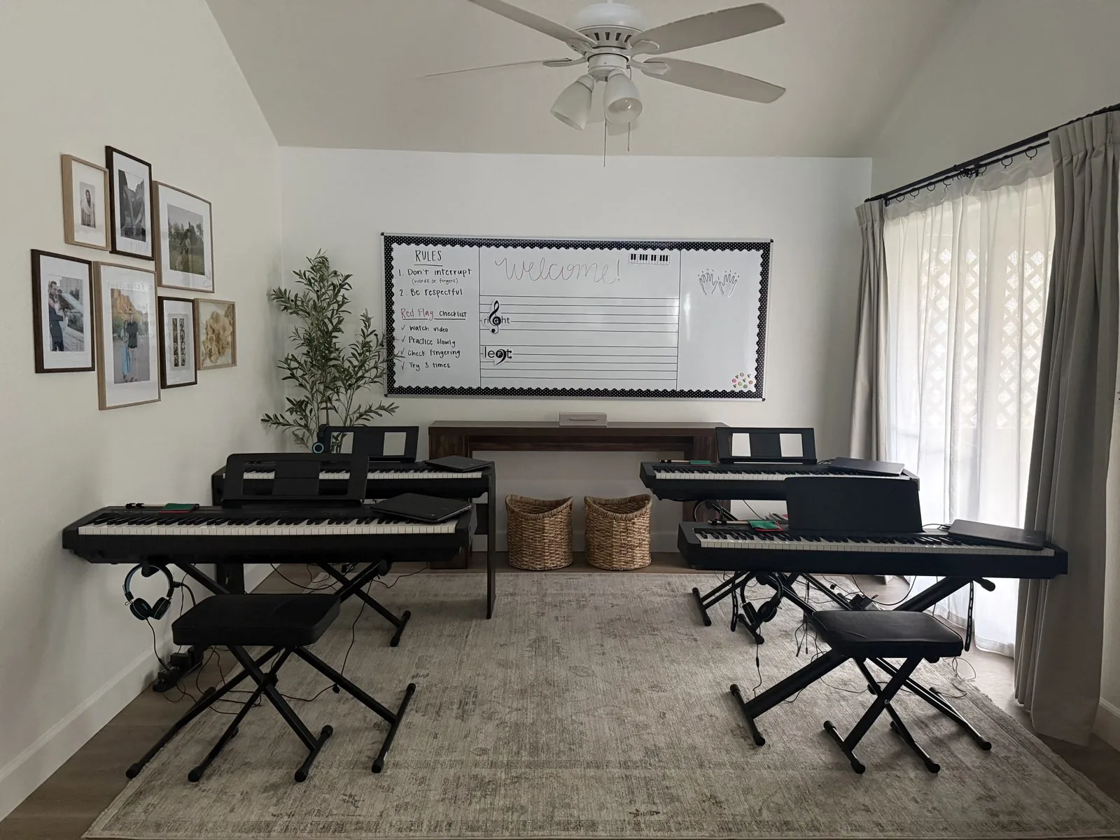 The Octave & Co. piano studio with keyboards, benches, and a whiteboard