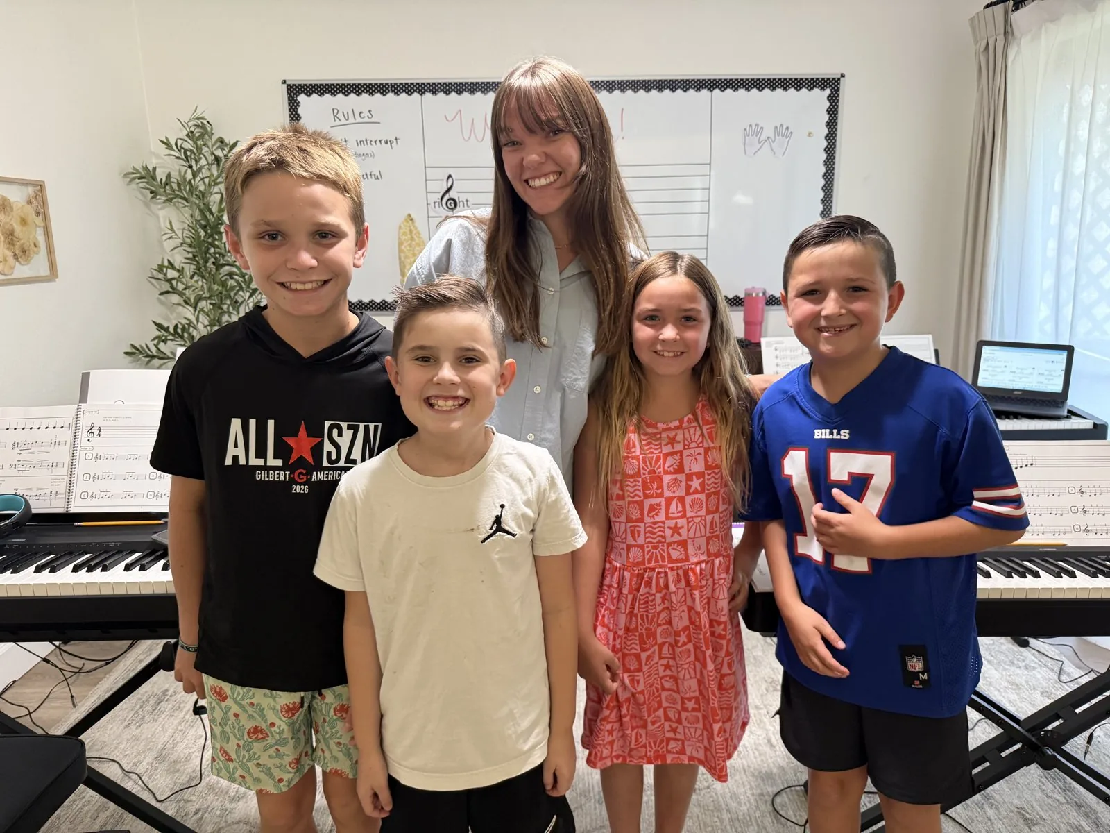 Piano students with their teacher at Octave & Co. Piano Lessons